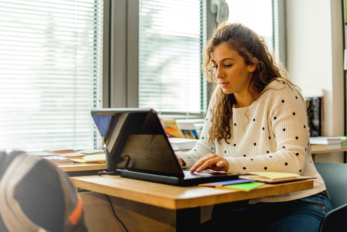 woman taking an MCAT practice test to prepare for the exam