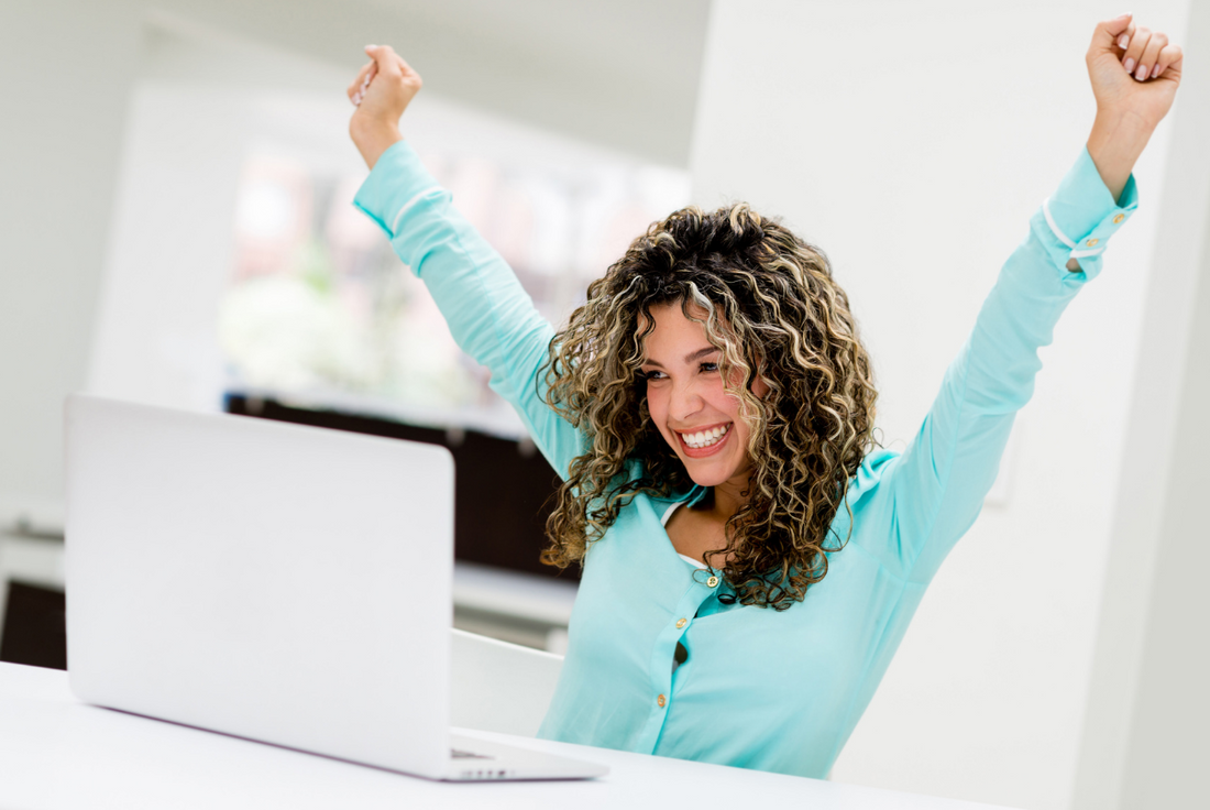 woman celebrating her good GMAT score