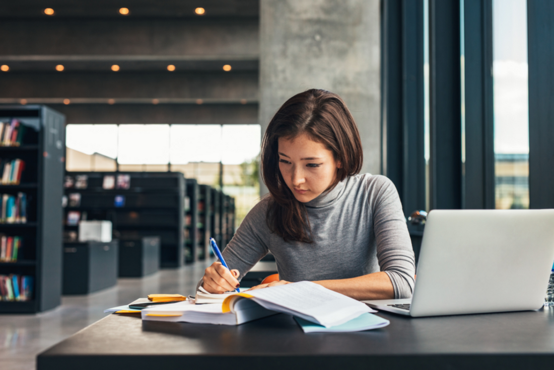 woman taking a GMAT practice test to prepare for exam day