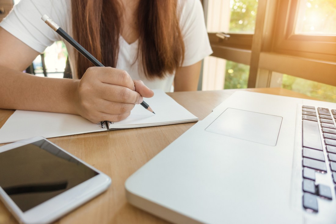 woman studying for the GMAT exam in one month