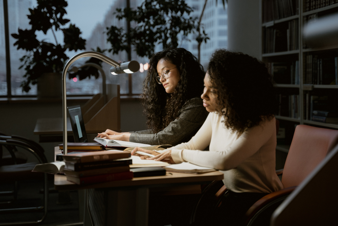 Two women studying to prepare for the LSAT exam